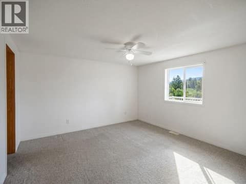 MH Main Level - Primary Bedroom at 327 97A Highway, Armstrong/ Spall., Spallumcheen