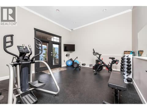 Gym w rubber flooring and additional walk out access at 2328 Arthur Court, McKinley Landing, Kelowna