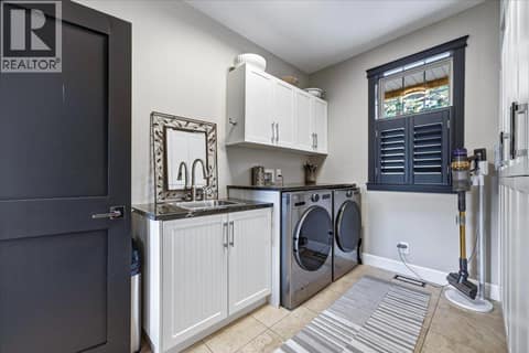 Main floor laundry room off attached garage at 2328 Arthur Court, McKinley Landing, Kelowna