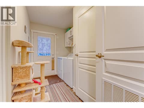 Laundry room and back door at 1600 43 Avenue Unit# 25, Harwood, Vernon