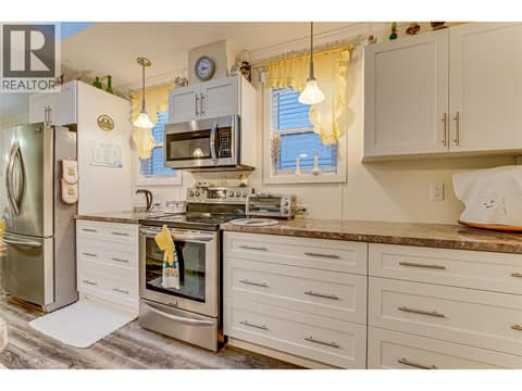 Stainless appliances, skylights overhead. at 1600 43 Avenue Unit# 25, Harwood, Vernon