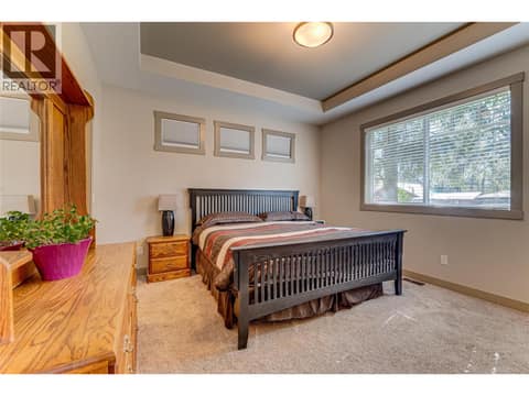Primary bedroom on the main floor at 270 Grouse Avenue, Okanagan North, Vernon