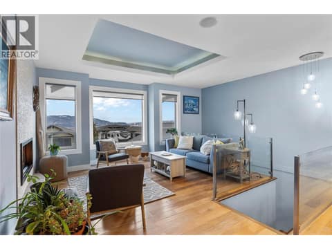 Big picture windows in the living room at 529 Whitecourt Place, Foothills, Vernon