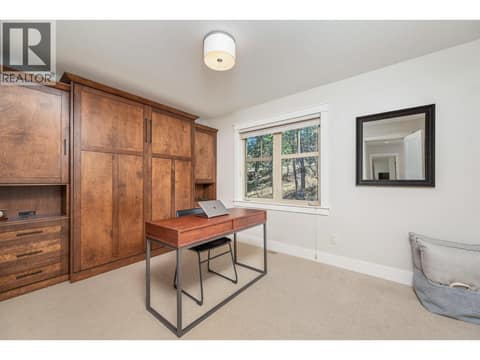 Maximize the space when you need it —- a cozy den or functional office. at 333 Longspoon Drive Unit# 26, Predator Ridge, Vernon