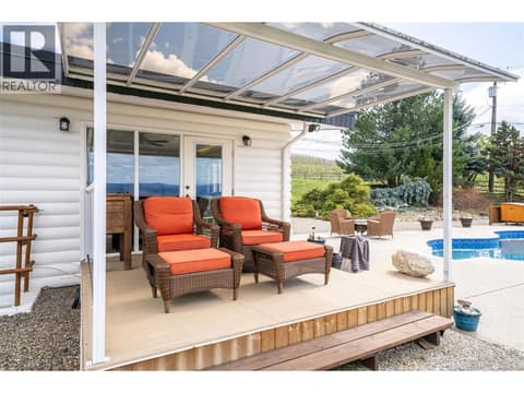 Patio Off Primary Bed. at 701 Robin Road, South BX, Vernon