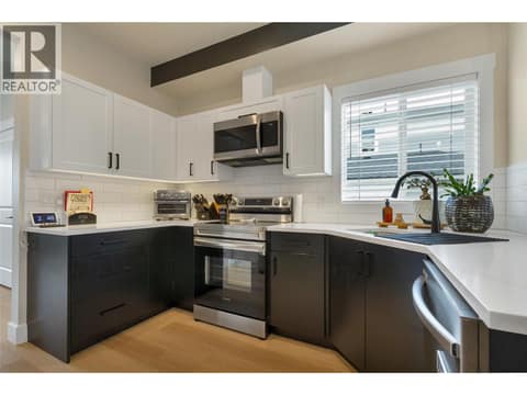 Full kitchen in a semi open concept layout. at 1999 15 Avenue Unit# 9, East Hill, Vernon