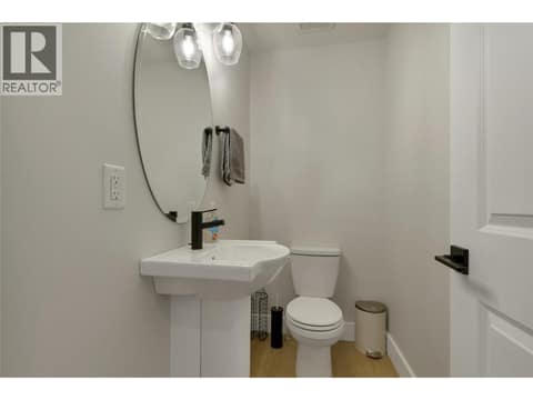 Powder room on the main level. at 1999 15 Avenue Unit# 9, East Hill, Vernon