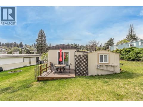 Cute back deck off the primary bedroom. at 12022 Pretty Road Unit# 16, Lake Country South West
