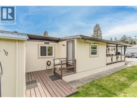 Door to the den or mud room and deck space between the home and workshop/man-cave/she-shed. at 12022 Pretty Road Unit# 16, Lake Country South West
