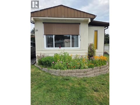 Front of the home with plants from last summer. at 12022 Pretty Road Unit# 16, Lake Country South West