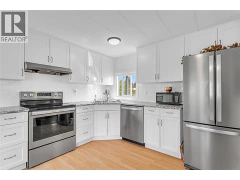 Stainless appliances in the updated kitchen at 12022 Pretty Road Unit# 16, Lake Country South West