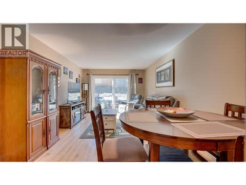 Main Floor: Dining Room is open to Living Room. at 1041 Middleton Way Unit# 102, Middleton Mountain Vernon