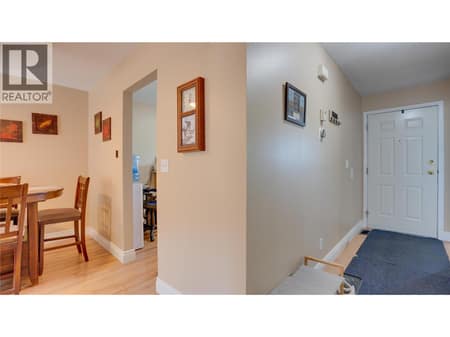 Main Floor: Entryway on the right, Dining Room & Kitchen entry to the left. at 1041 Middleton Way Unit# 102, Middleton Mountain Vernon