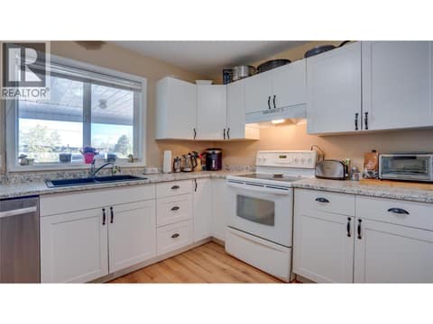 Main Floor: Kitchen. at 1041 Middleton Way Unit# 102, Middleton Mountain Vernon