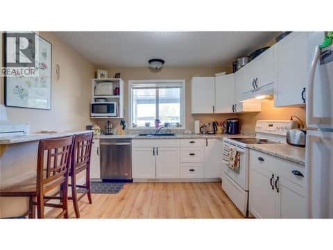 Main Floor: Kitchen has eat-in option. at 1041 Middleton Way Unit# 102, Middleton Mountain Vernon