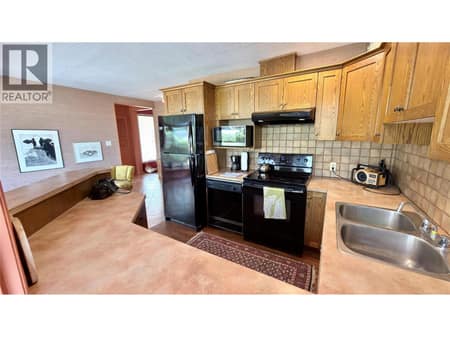 Family home kitchen area very spacious at 15230 89th Street, Osoyoos Rural