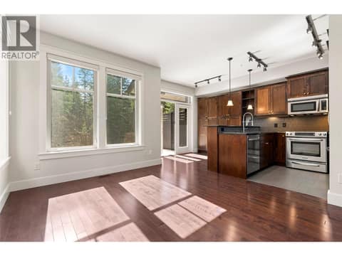 Kitchen flooded with south-facing light at 333 Longspoon Drive Unit# 35, Predator Ridge, Vernon