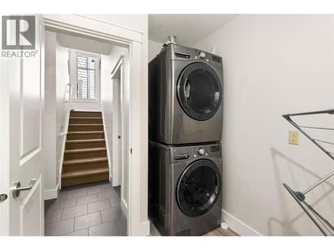 Lower level laundry room with plumbing for another bathroom at 333 Longspoon Drive Unit# 35, Predator Ridge, Vernon