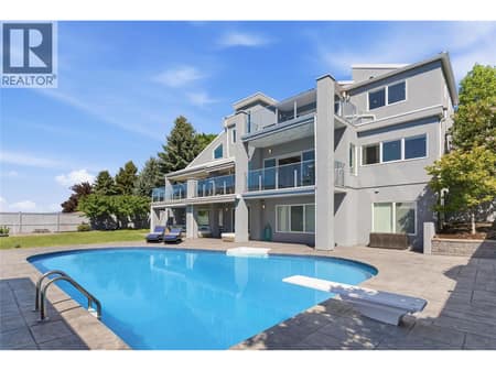 Backyard oasis with a separate pool shed to store equipment at 2090 Bennett Road, McKinley Landing, Kelowna