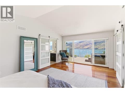 Expansive windows to enjoy the views of Okanagan Lake at 2090 Bennett Road, McKinley Landing, Kelowna