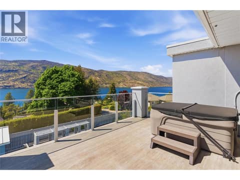 Front sun deck-connects to the second level/primary bedroom with a hot tub for evening relaxation at 2090 Bennett Road, McKinley Landing, Kelowna