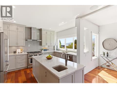 Fully updated kitchen on the main floor with plenty of room to cook gourmet meals and hang out with friends and family at 2090 Bennett Road, McKinley Landing, Kelowna