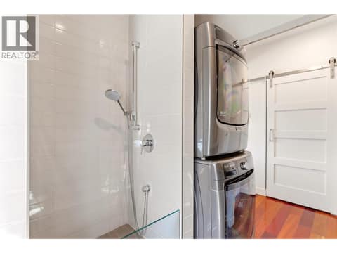 Main floor laundry with a convenient dog wash station at 2090 Bennett Road, McKinley Landing, Kelowna