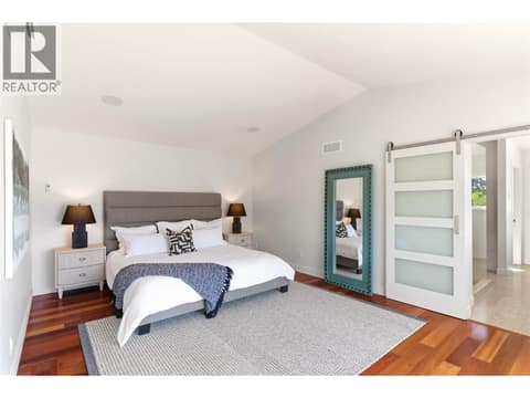 Primary bedroom on the second level with access to 2 private decks at 2090 Bennett Road, McKinley Landing, Kelowna