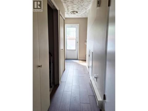 Hallway back to back door and to the left is where the laundry hook ups are. at 4102 24 Avenue Unit# 2, South Vernon
