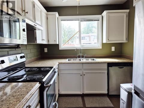 Kitchen from dining room at 4102 24 Avenue Unit# 2, South Vernon