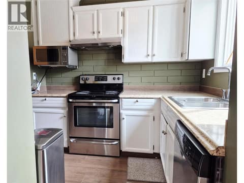 Kitchen with range, dishwasher, refridgerator at 4102 24 Avenue Unit# 2, South Vernon