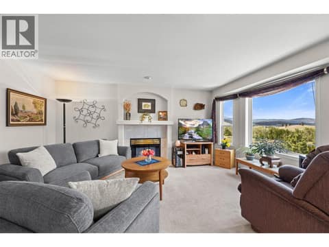 Living room overlooking the mountains at 4450 Postill Drive Unit# 14, Ellison, Kelowna