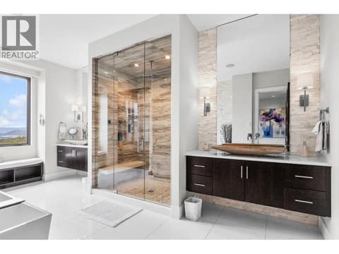 Steam shower and two vanities with elegant vessel sinks at 162 Skyland Drive, Wilden, Kelowna