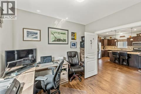 Den looking into kitchen at 8300 GALLAGHER LAKE FRONTAGE Road Unit# 91, Oliver Rural