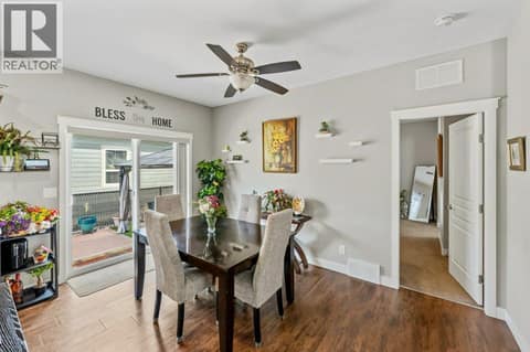 Dining area with slider s to patio at 8300 GALLAGHER LAKE FRONTAGE Road Unit# 91, Oliver Rural