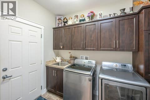 Laundry room with sink at 8300 GALLAGHER LAKE FRONTAGE Road Unit# 91, Oliver Rural