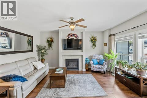Living room with gas fireplace at 8300 GALLAGHER LAKE FRONTAGE Road Unit# 91, Oliver Rural