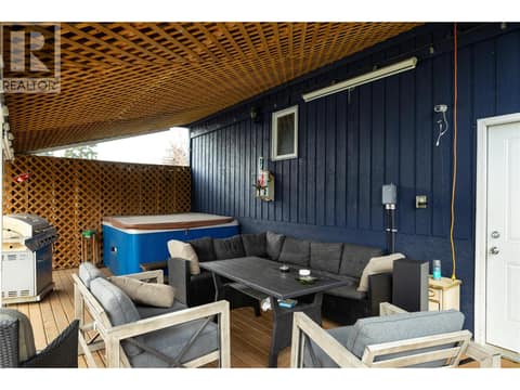 Covered rear deck with hot tub at 5712 6 Highway, Lavington, Vernon