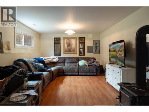 Family room (wood stove is not WETT Certified) included as is. at 5712 6 Highway, Lavington, Vernon
