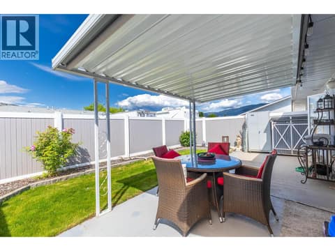 Covered patio offers a wonderful space for morning coffee, outdoor dining, or relaxing in any season. at 3900 27 Avenue Unit# 49, Westmount, Vernon