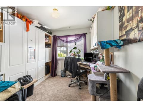 Versatile second bedroom featuring a convenient Murphy bed, making it perfect for guests or a home office. at 3900 27 Avenue Unit# 49, Westmount, Vernon