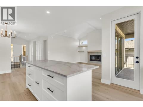 Kitchen looking into Living Room at 2150 Montenegro Drive, Black Mountain, Kelowna