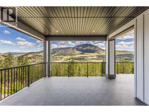 Large Covered Deck off Main Floor Kitchen and Living Room at 2150 Montenegro Drive, Black Mountain, Kelowna
