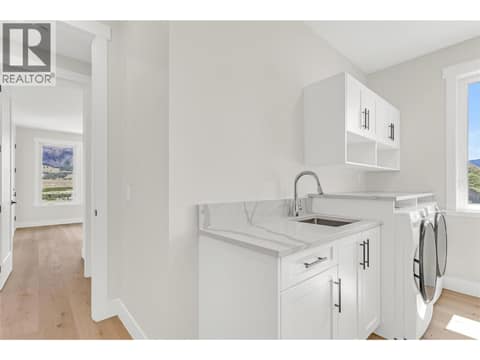 Laundry/mud room conveniently located off the garage at 2150 Montenegro Drive, Black Mountain, Kelowna