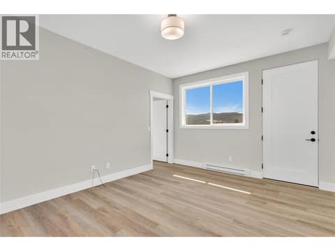 Legal Suite Entry and Living Room at 2150 Montenegro Drive, Black Mountain, Kelowna