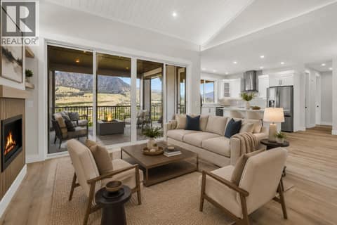 Living Room looking into Kitchen and onto Covered Deck *Virtually Staged* at 2150 Montenegro Drive, Black Mountain, Kelowna
