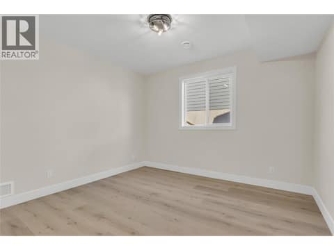 Lower Level Bedroom #1 at 2150 Montenegro Drive, Black Mountain, Kelowna