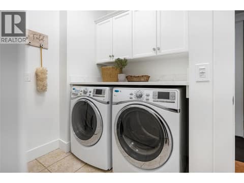 Laundry on main level and conveniently located off garage at 108 Mashie Crescent, Predator Ridge, Vernon