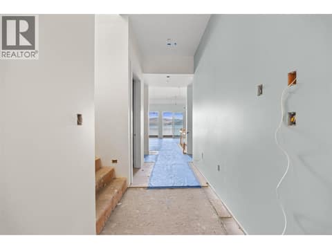 Entry and Stairs to Upper Level at 9701 Delcliffe Road, Okanagan Landing, Vernon