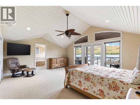 Upper-level primary bedroom at 7769 Okanagan Landing Road Unit# 7, Okanagan Landing, Vernon
